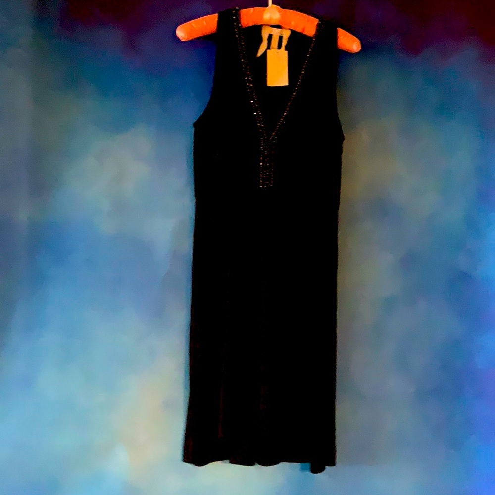 A little black dress with beading, v-neckline and zippered side.